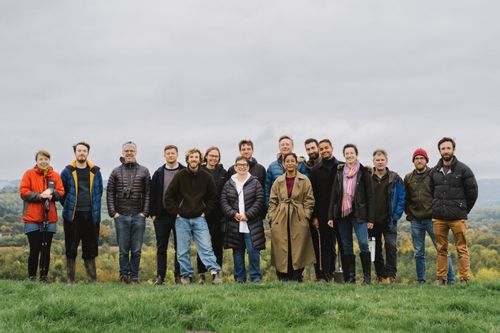 The Soil Association Exchange team group photo. Posing in a green, autumnal landscape  – Somerset's beautiful Chew Valley.